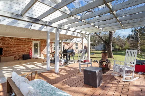 a view of a patio with a dining table and chairs