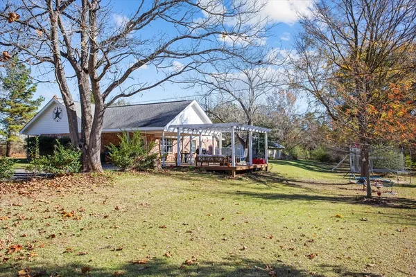 a view of a playground with a tree