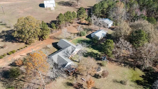 an aerial view of house with a yard