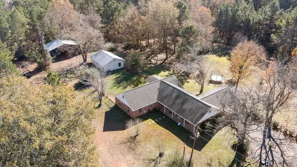an aerial view of houses with yard