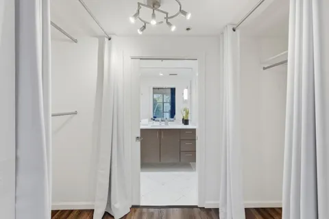 a bathroom with a sink vanity and mirror