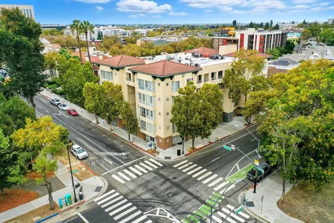 an aerial view of residential houses with outdoor space