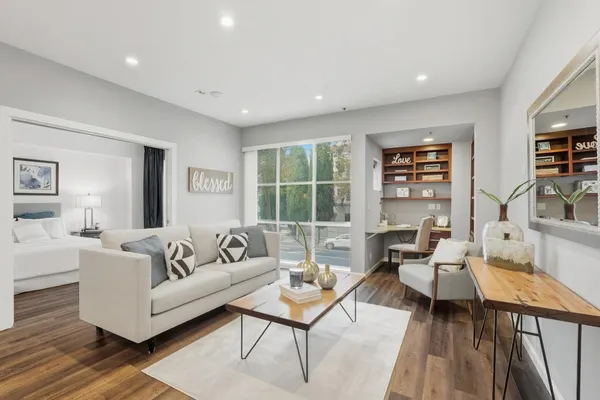 a living room with furniture and a window