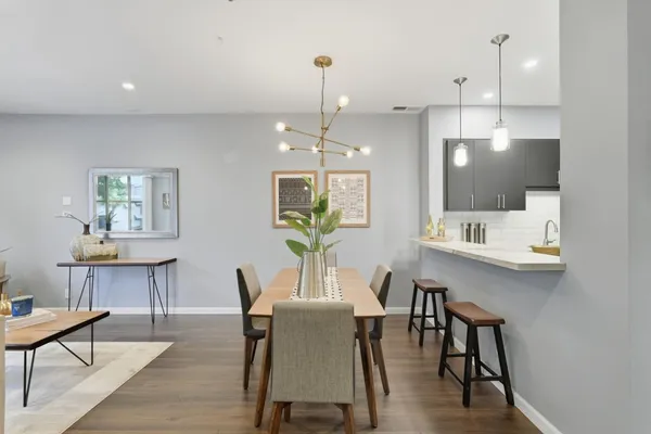 a view of a dining room with furniture window and wooden floor