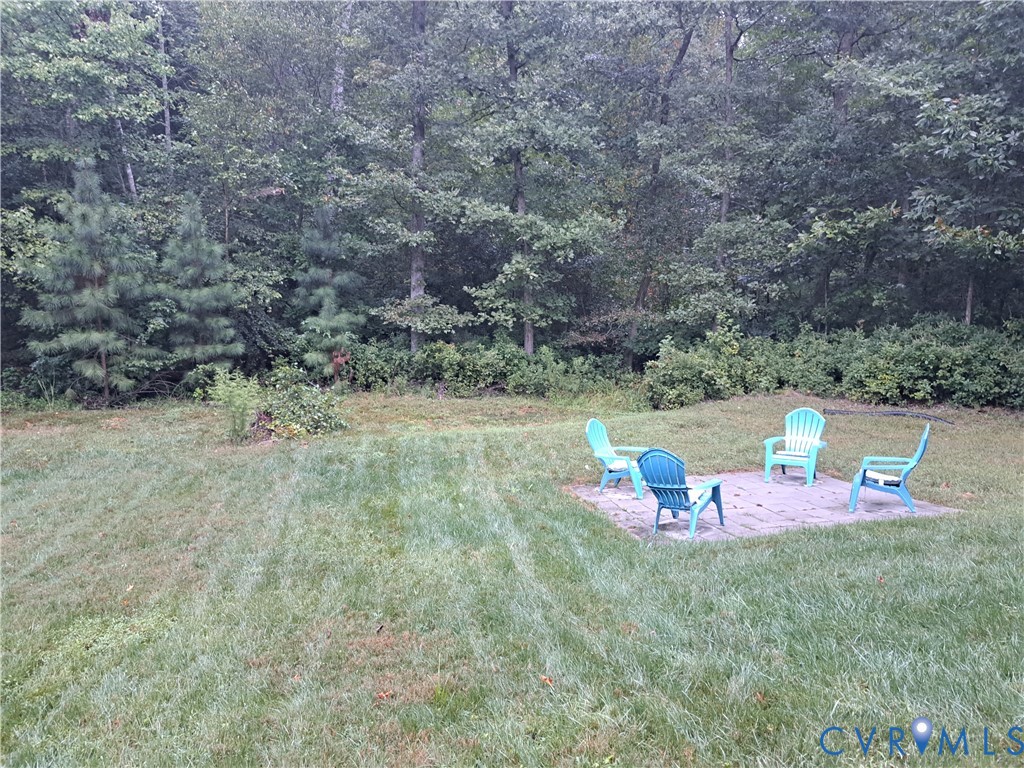 5347 Meadoway Road North Chesterfield, VA 23234 - Photo 5 of 31 Expansive grassy yard with a paver patio and matur