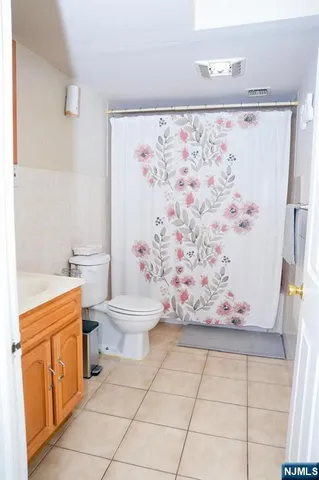a bathroom with a toilet sink and shower