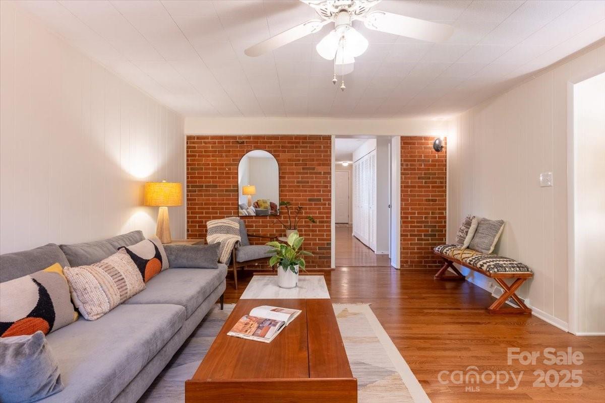 609 West Probart Street Brevard, NC 28712 - Photo 13 of 38 a living room with furniture and a chandelier