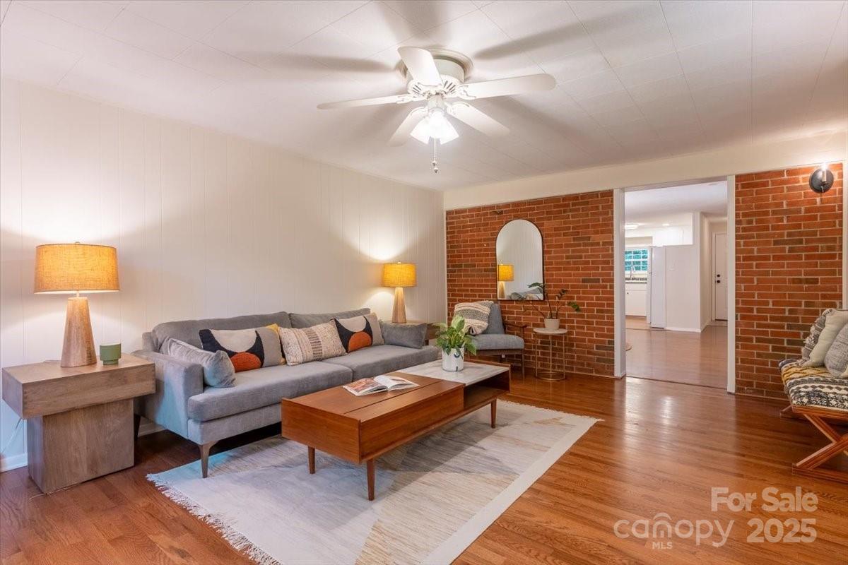 609 West Probart Street Brevard, NC 28712 - Photo 14 of 38 a living room with furniture and a lamp
