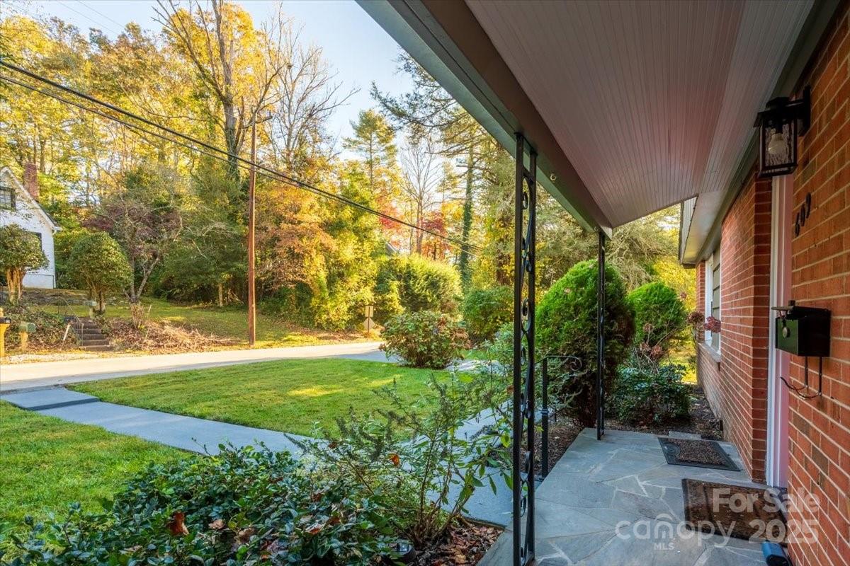 609 West Probart Street Brevard, NC 28712 - Photo 2 of 38 a view of a yard with plants and large trees
