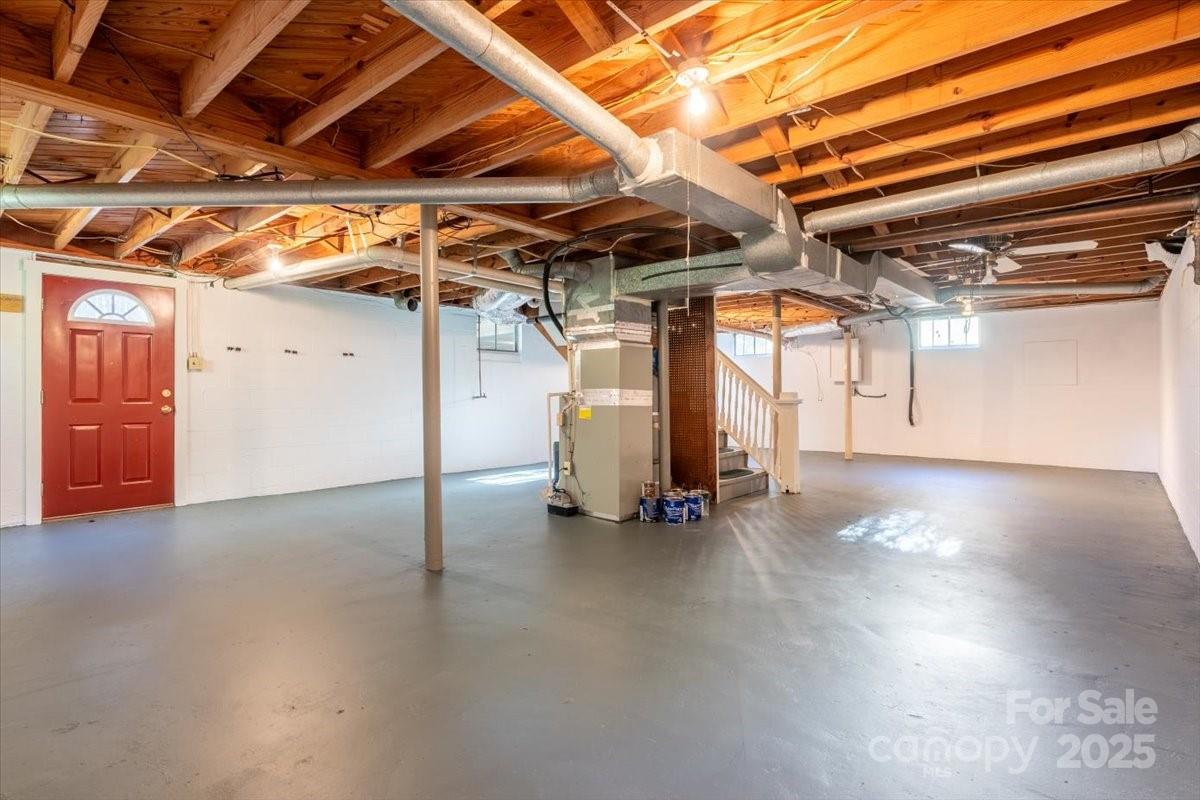 609 West Probart Street Brevard, NC 28712 - Photo 23 of 38 a view of an empty room with wooden roof