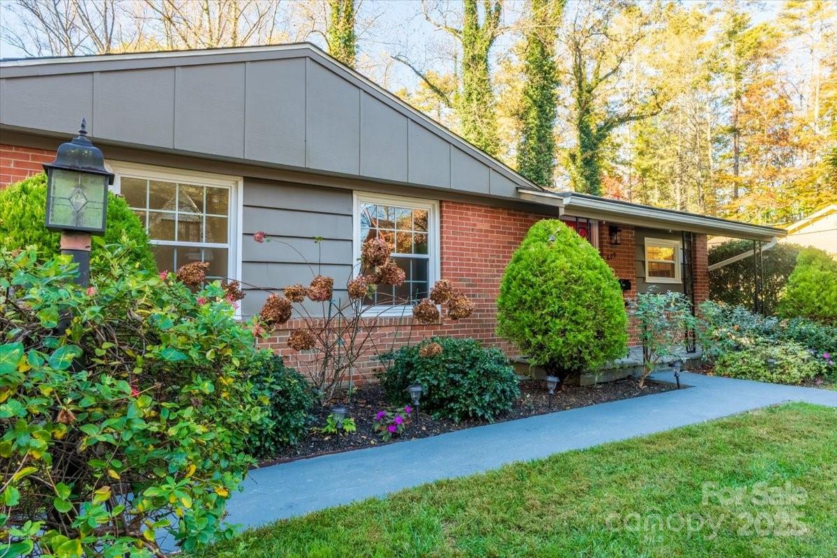 609 West Probart Street Brevard, NC 28712 - Photo 26 of 38 a front view of a house with garden