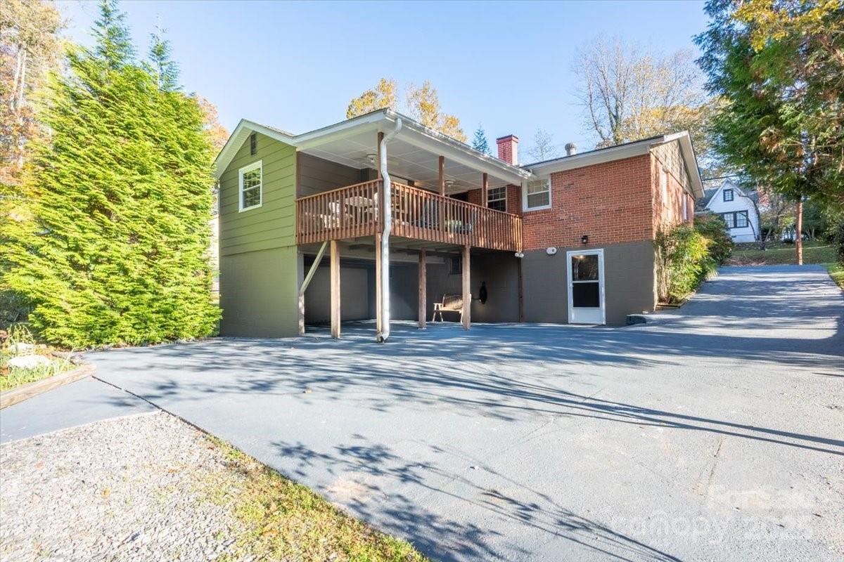 609 West Probart Street Brevard, NC 28712 - Photo 3 of 38 a front view of a house with a yard