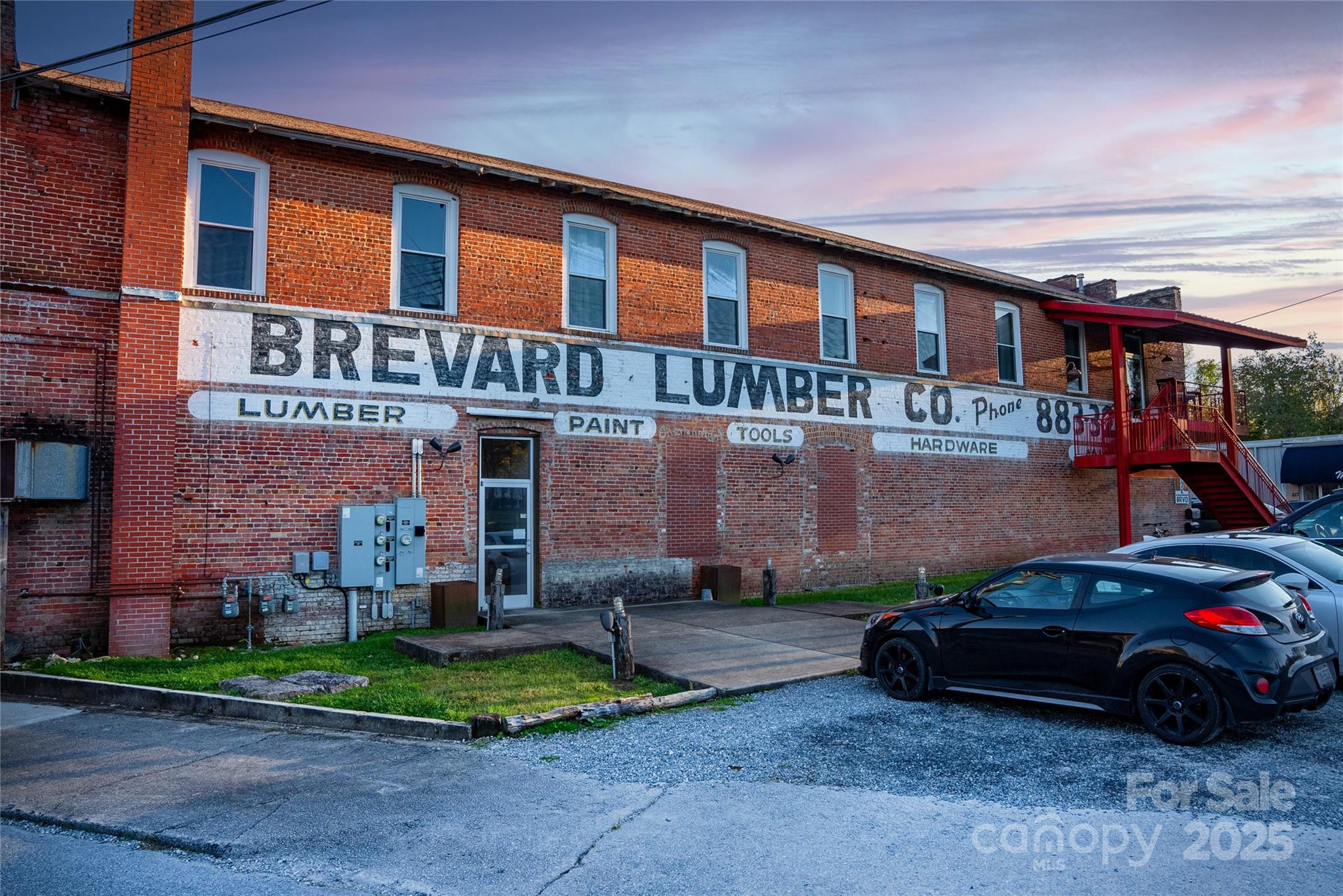 609 West Probart Street Brevard, NC 28712 - Photo 34 of 38 front view of a building with a yard