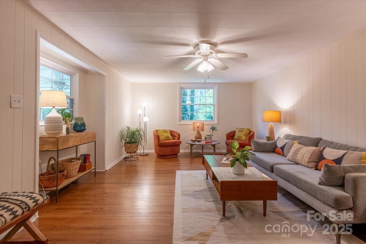 609 West Probart Street Brevard, NC 28712 - Photo 9 of 38 a living room with furniture and a chandelier