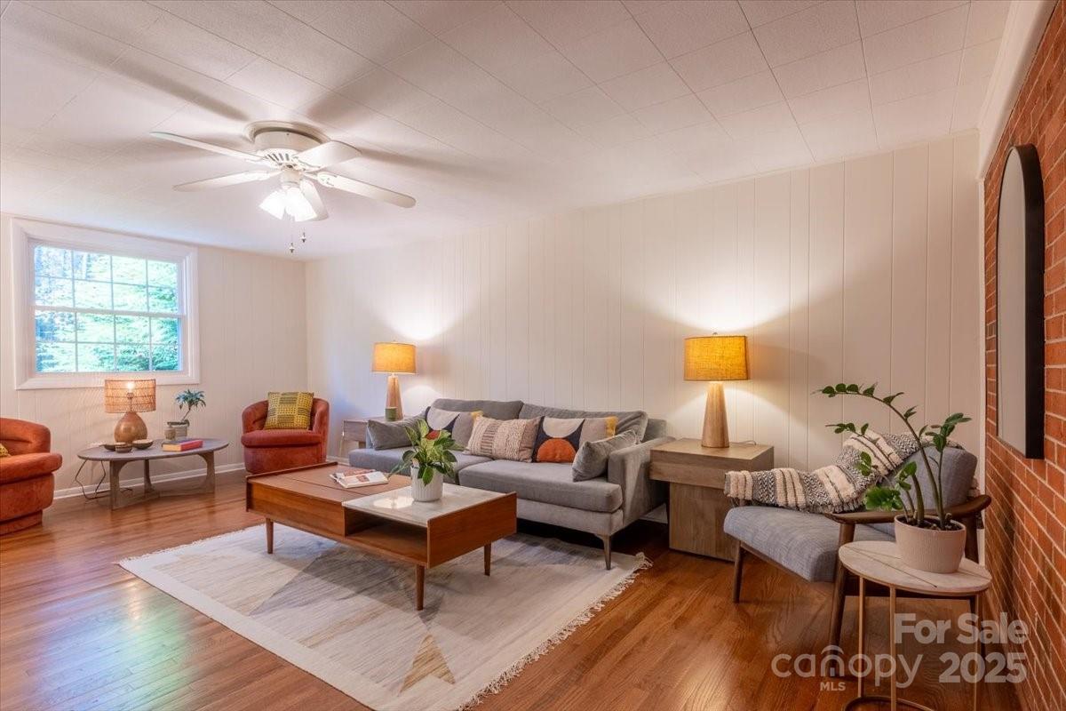 609 West Probart Street Brevard, NC 28712 - Photo 10 of 38 a living room with furniture and wooden floor