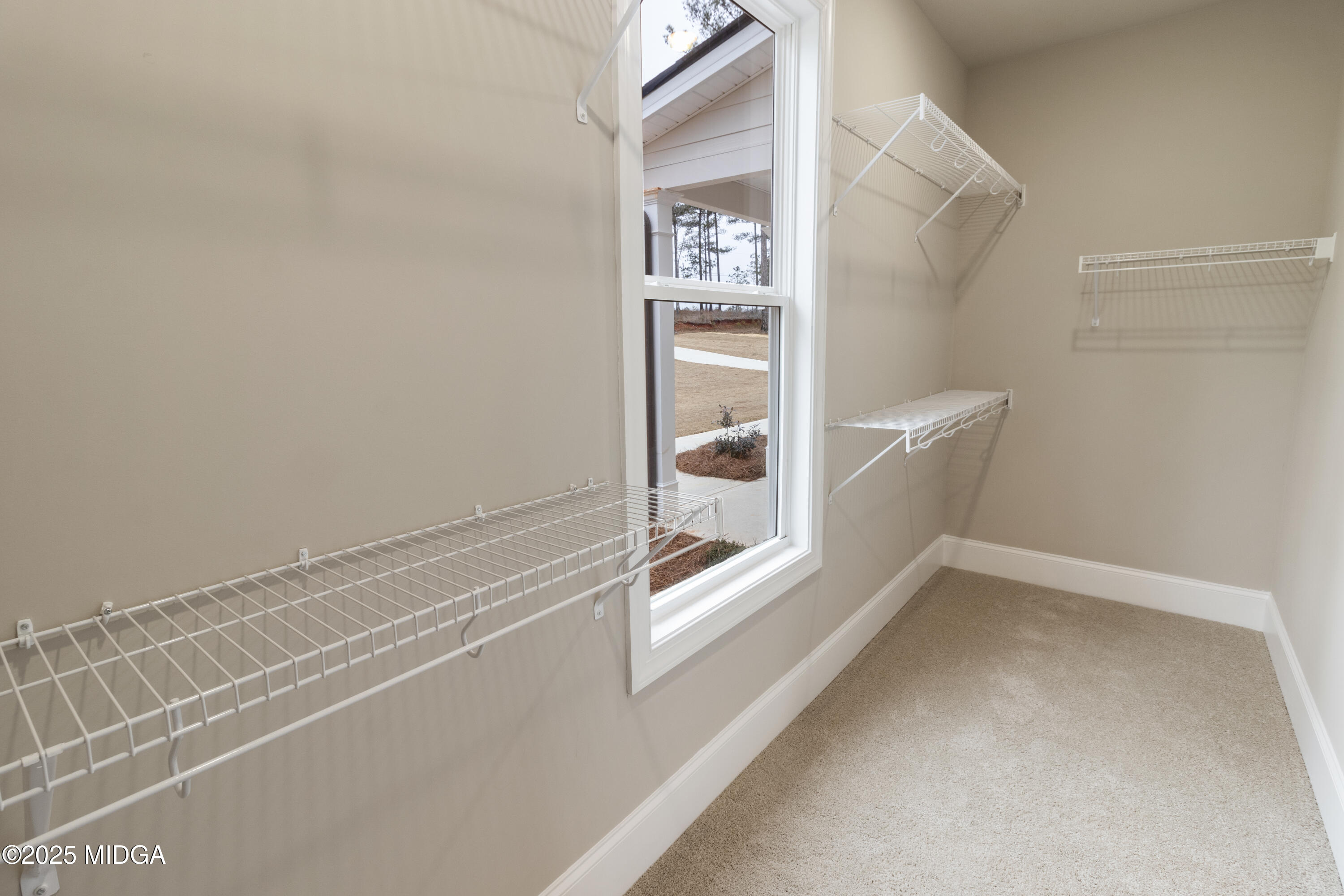 697 Giles Road Forsyth, GA 31029 - Photo 18 of 27 a view of an empty walk in closet