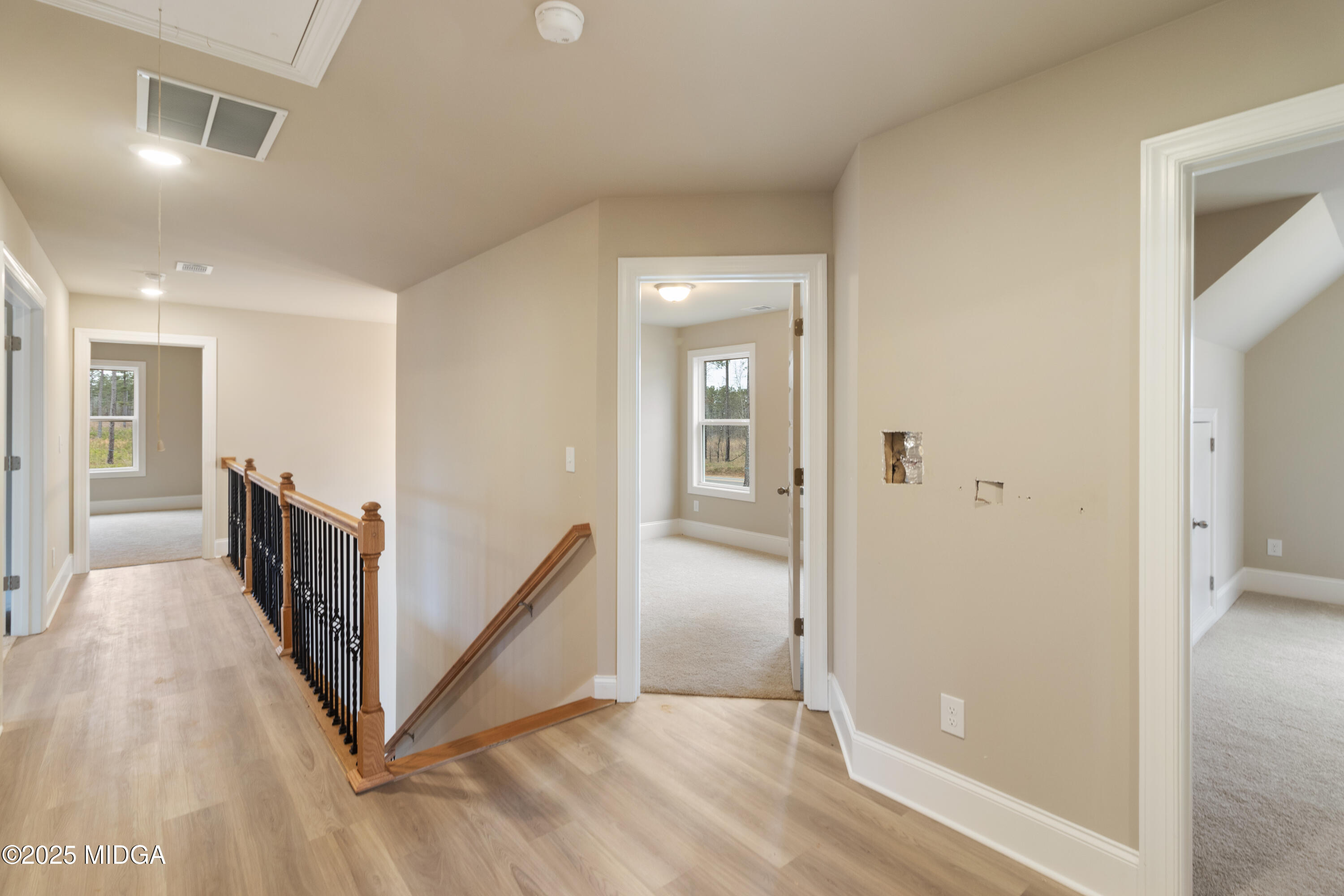 697 Giles Road Forsyth, GA 31029 - Photo 19 of 27 a view of a hallway view with three rooms