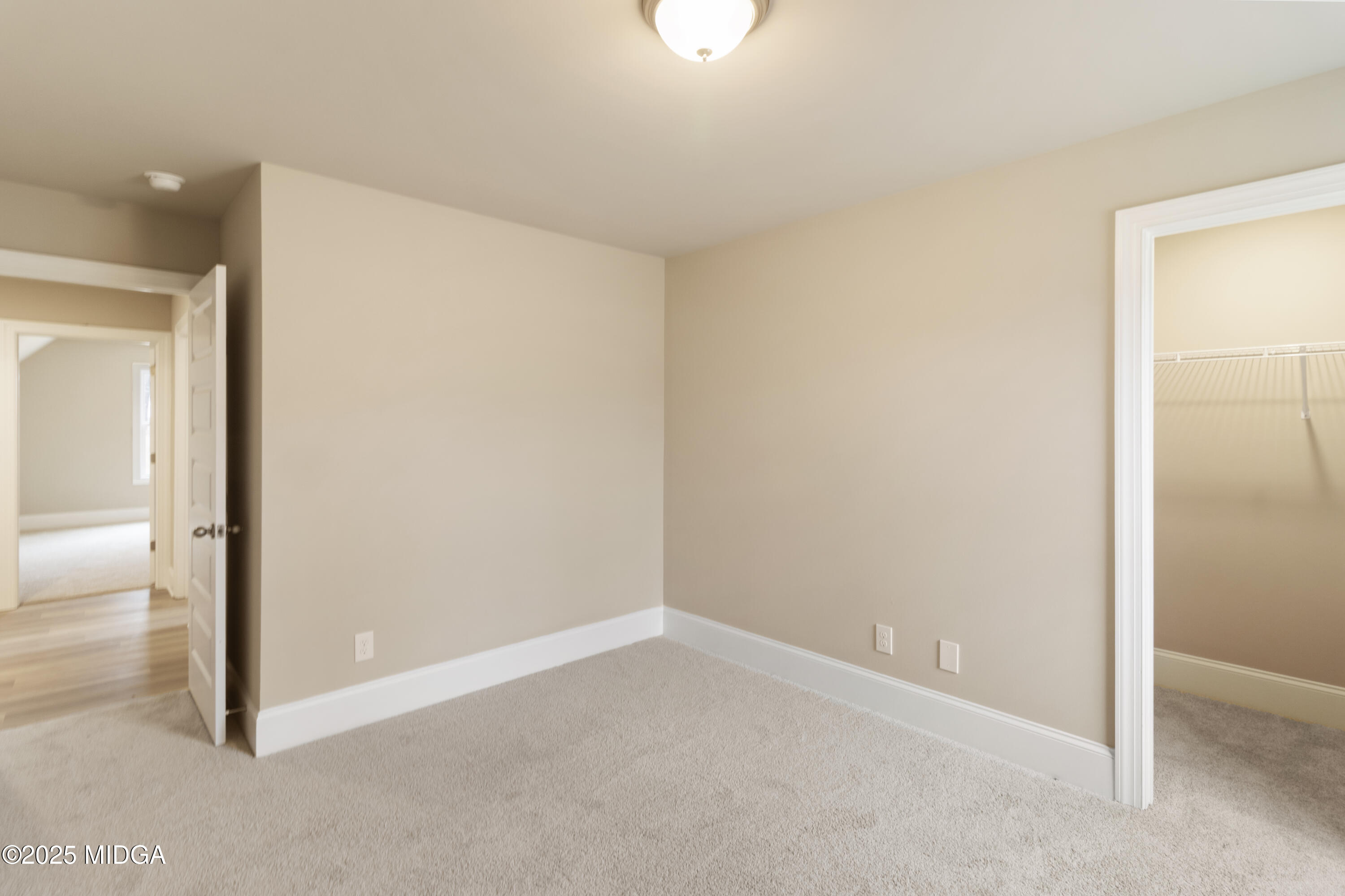 697 Giles Road Forsyth, GA 31029 - Photo 20 of 27 an empty room with windows