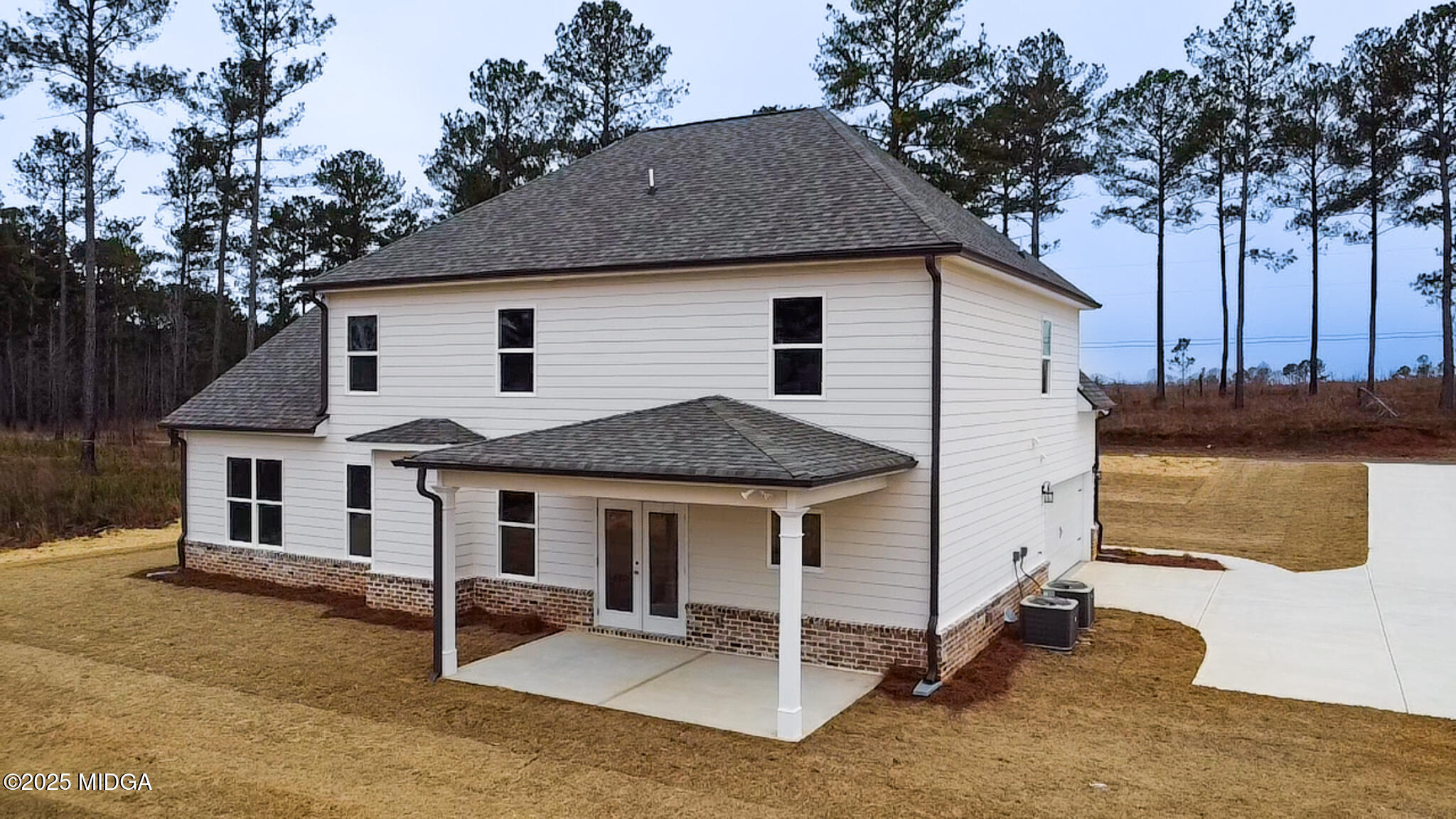 697 Giles Road Forsyth, GA 31029 - Photo 2 of 27 a front view of a house with a yard