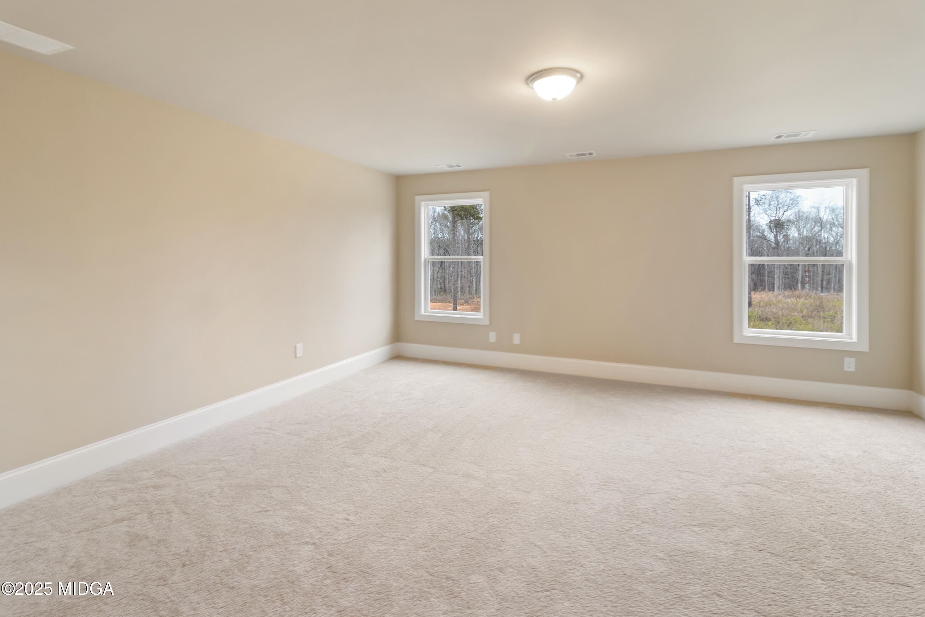 697 Giles Road Forsyth, GA 31029 - Photo 25 of 27 an empty room with a window