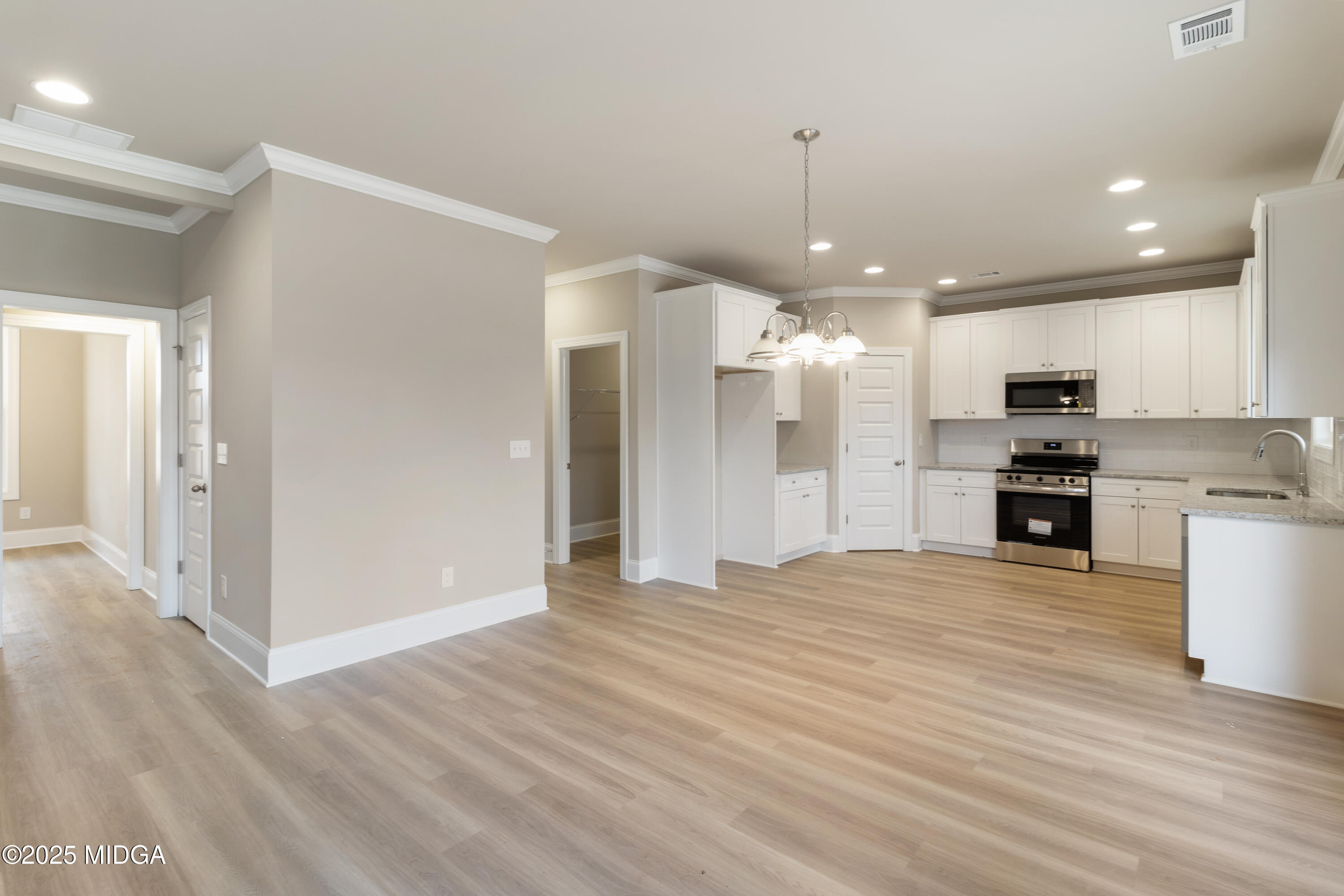697 Giles Road Forsyth, GA 31029 - Photo 9 of 27 a view of a kitchen with microwave and cabinets