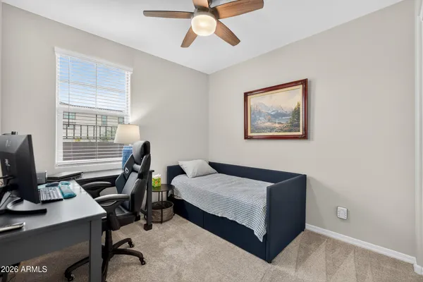 a bedroom with a bed and a window