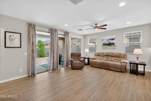 a living room with furniture and a large window