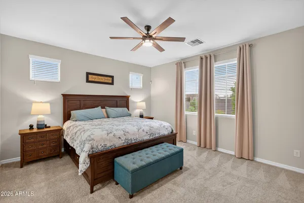 a bedroom with a bed and window