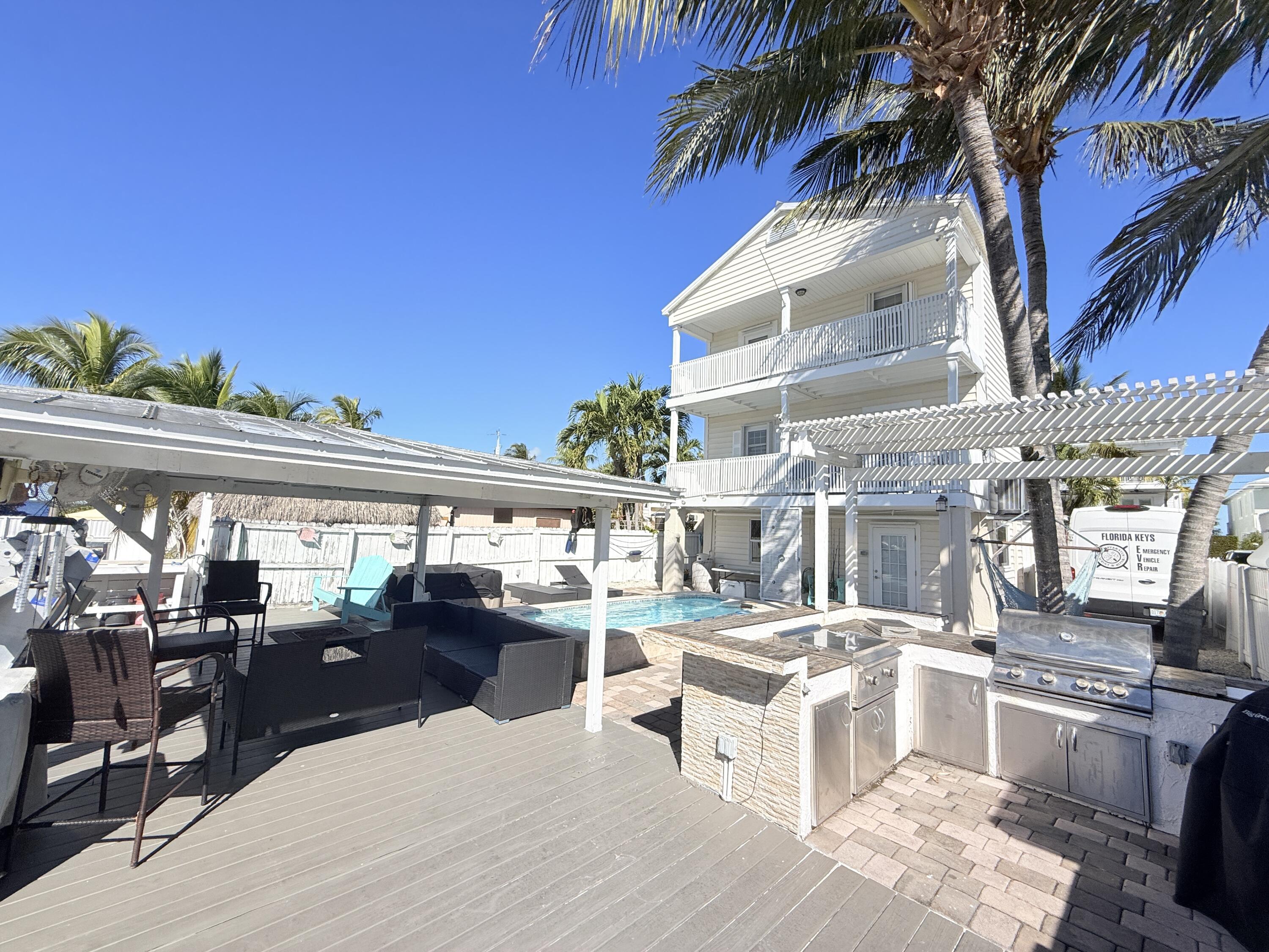 1313 Calder Road Key Largo, FL 33037 - Photo 13 of 72 BBQ area, pool and dock