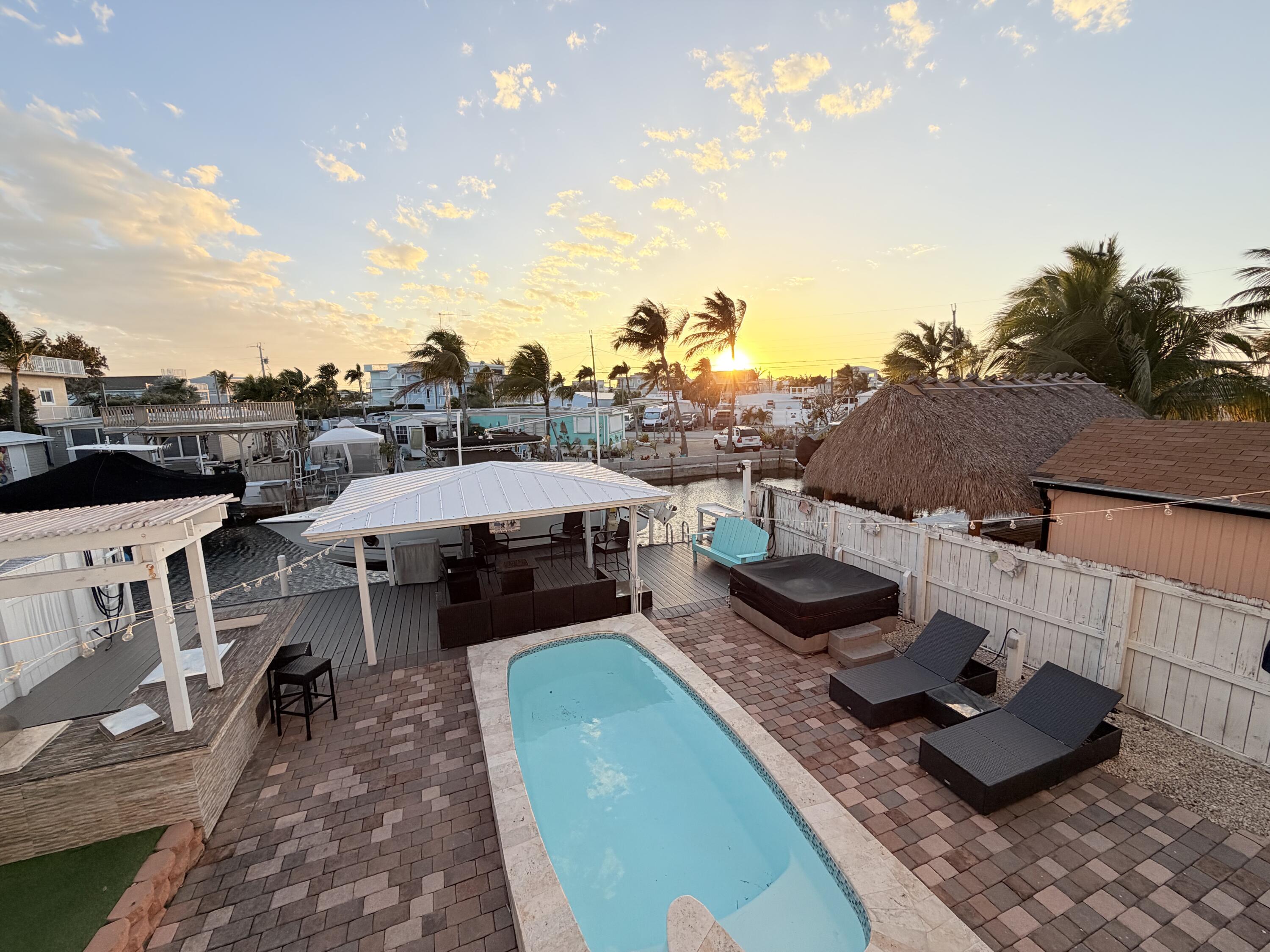 1313 Calder Road Key Largo, FL 33037 - Photo 7 of 72 Backyard Area Sunset