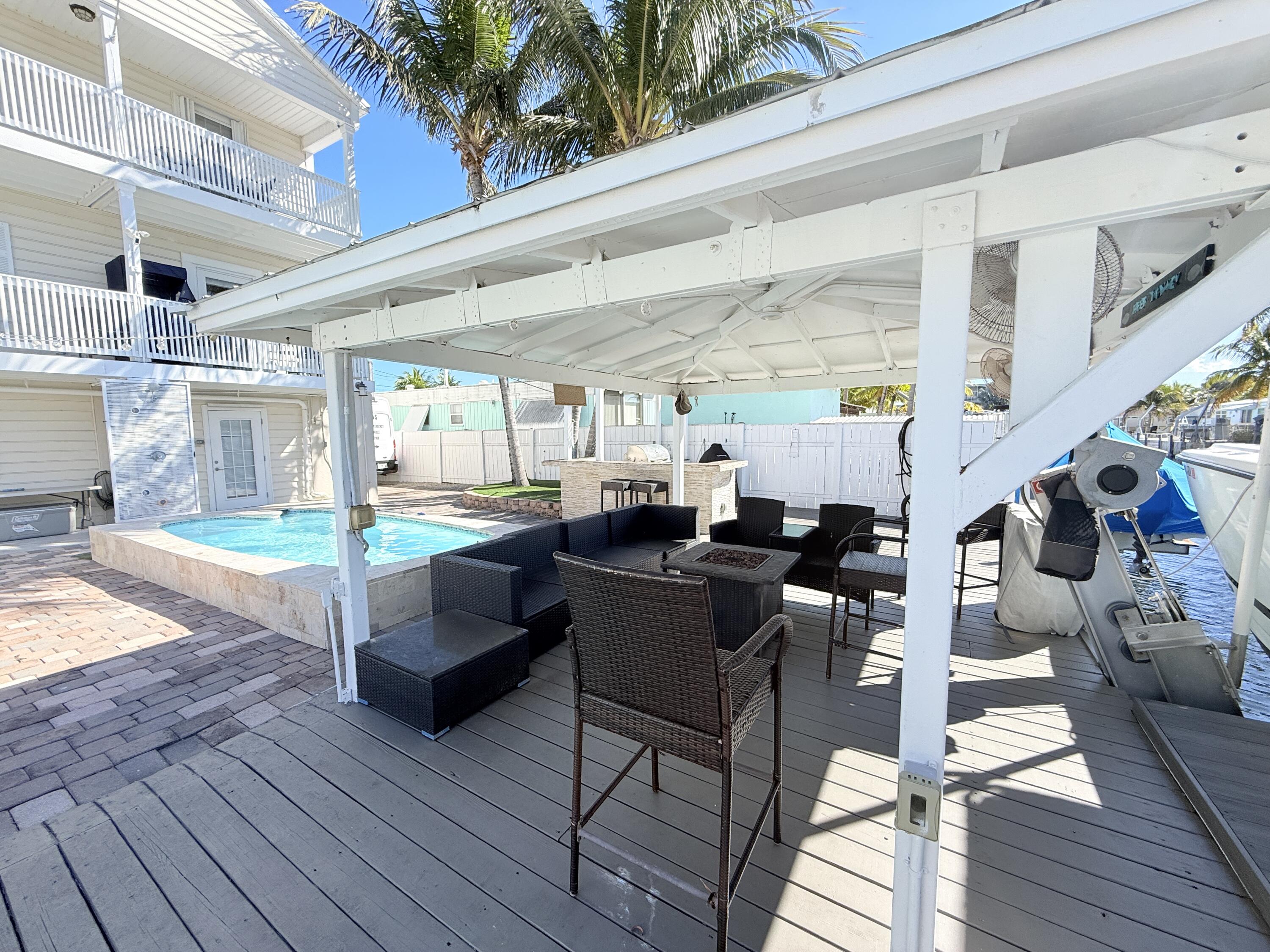 1313 Calder Road Key Largo, FL 33037 - Photo 9 of 72 Chickee hut by pool and dock