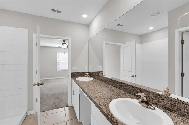 a white toilet sitting next to a white sink