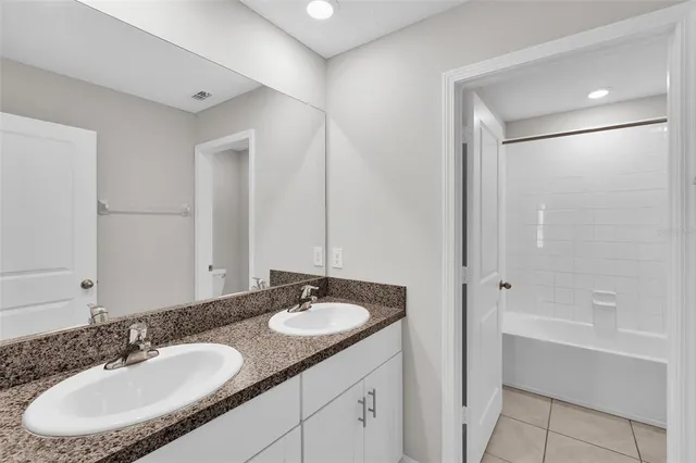 a bathroom with a bathtub and a toilet