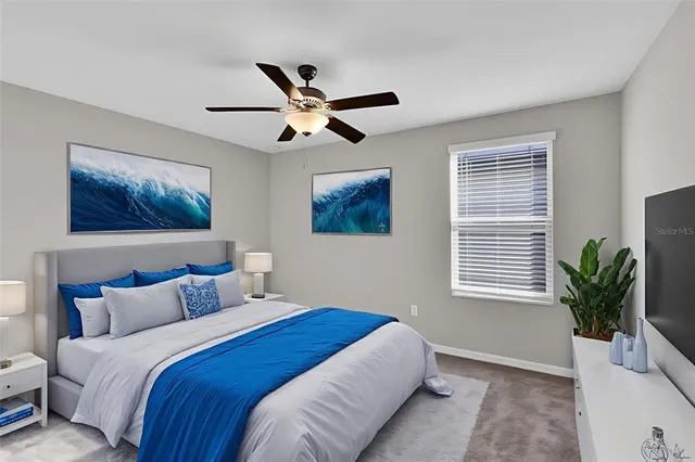 a bedroom with a large bed and a window