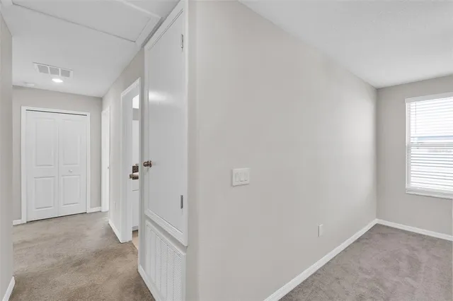 a white toilet sitting next to a shower