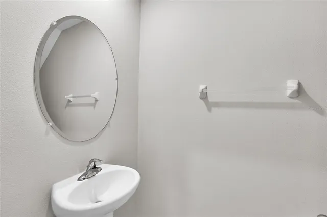 a yellow building with trees in front of it