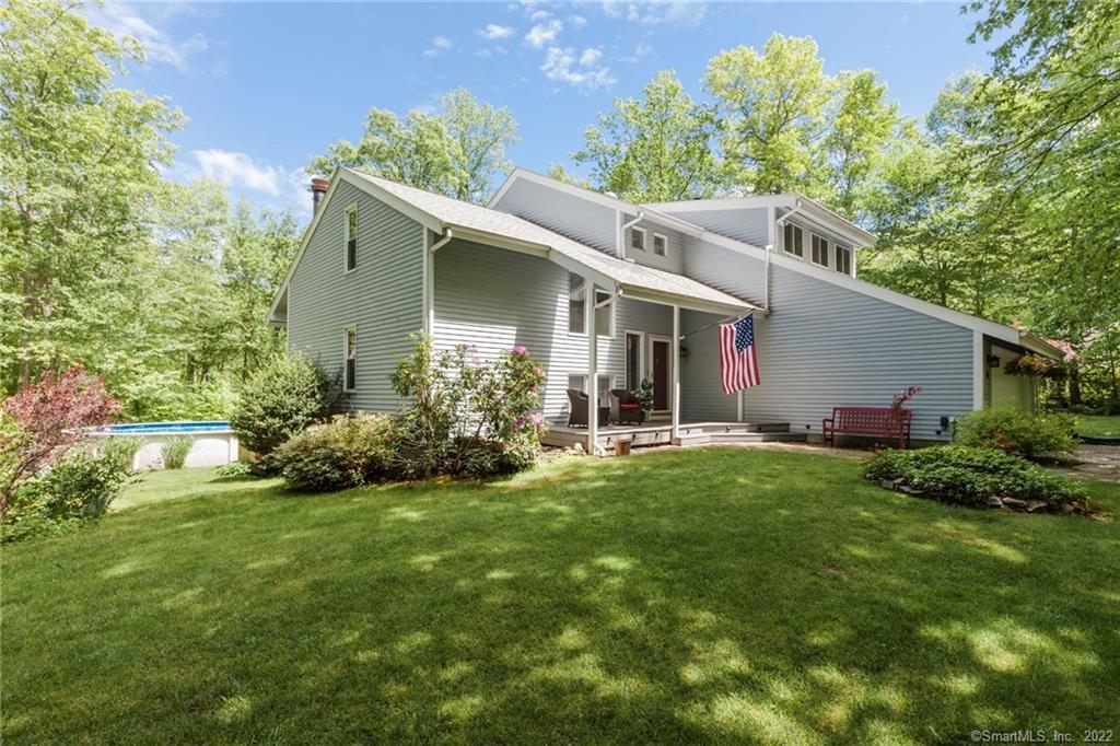 13 Sperry Road Madison, CT 06443 - Photo 1 of 1 Front Exterior, showing the pool in the back and the porch on the front.