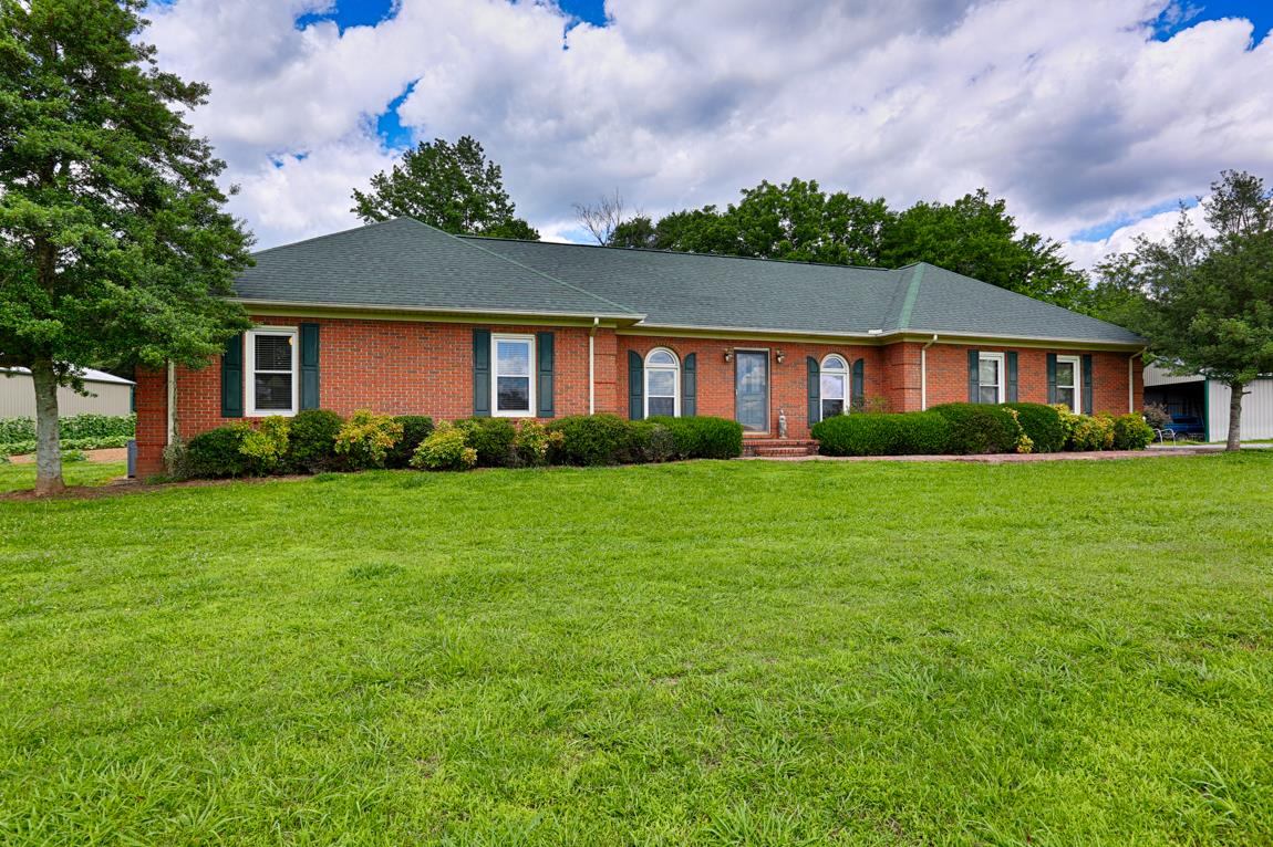 6536 Prospect Road Prospect, TN 38477 - Photo 2 of 30 a front view of house with yard and green space