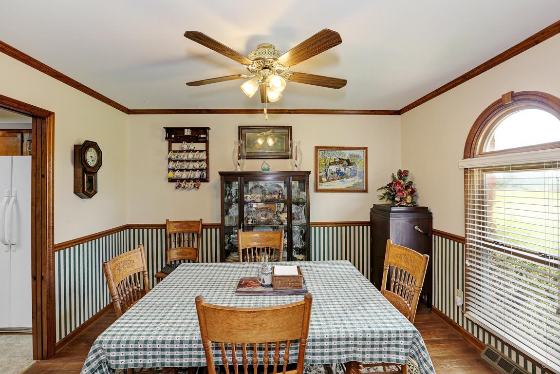 6536 Prospect Road Prospect, TN 38477 - Photo 11 of 30 a living room with furniture a table and paintings on the wall