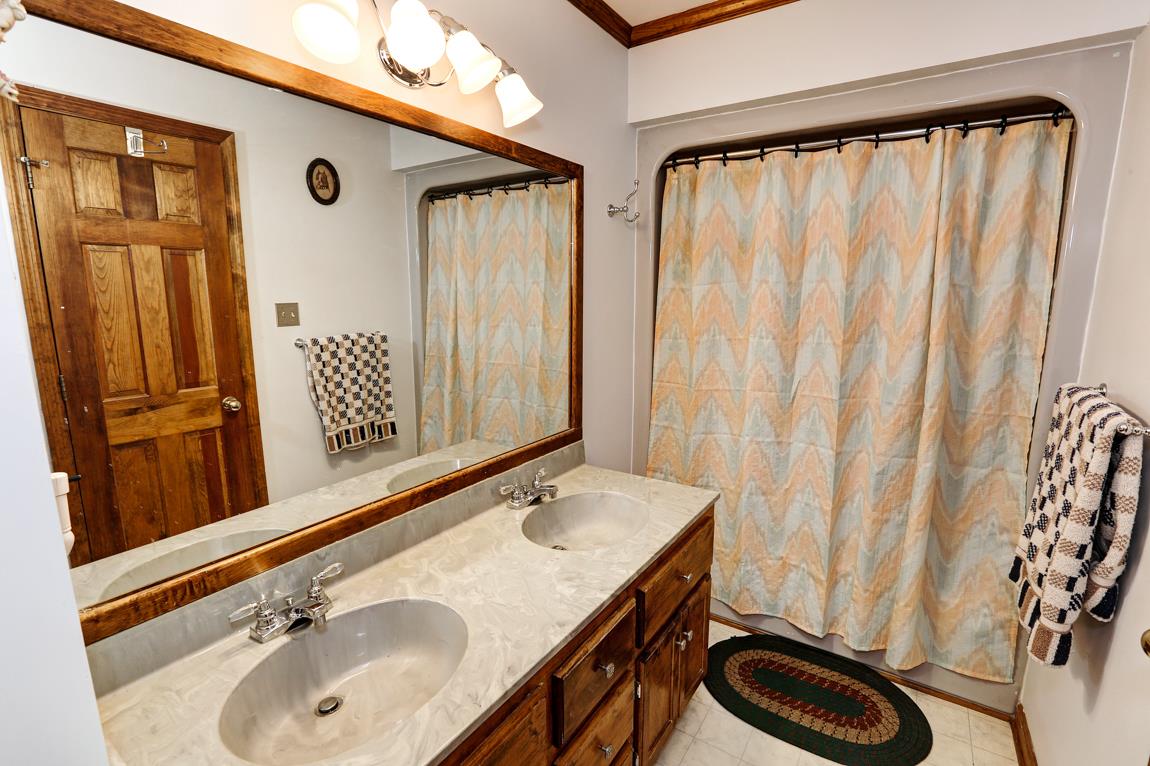 6536 Prospect Road Prospect, TN 38477 - Photo 17 of 30 a bathroom with a sink and a mirror