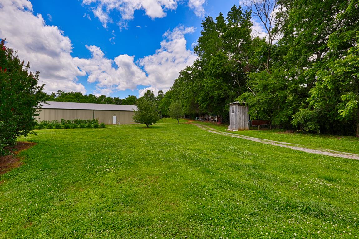 6536 Prospect Road Prospect, TN 38477 - Photo 20 of 30 a front view of a house with garden and a tree