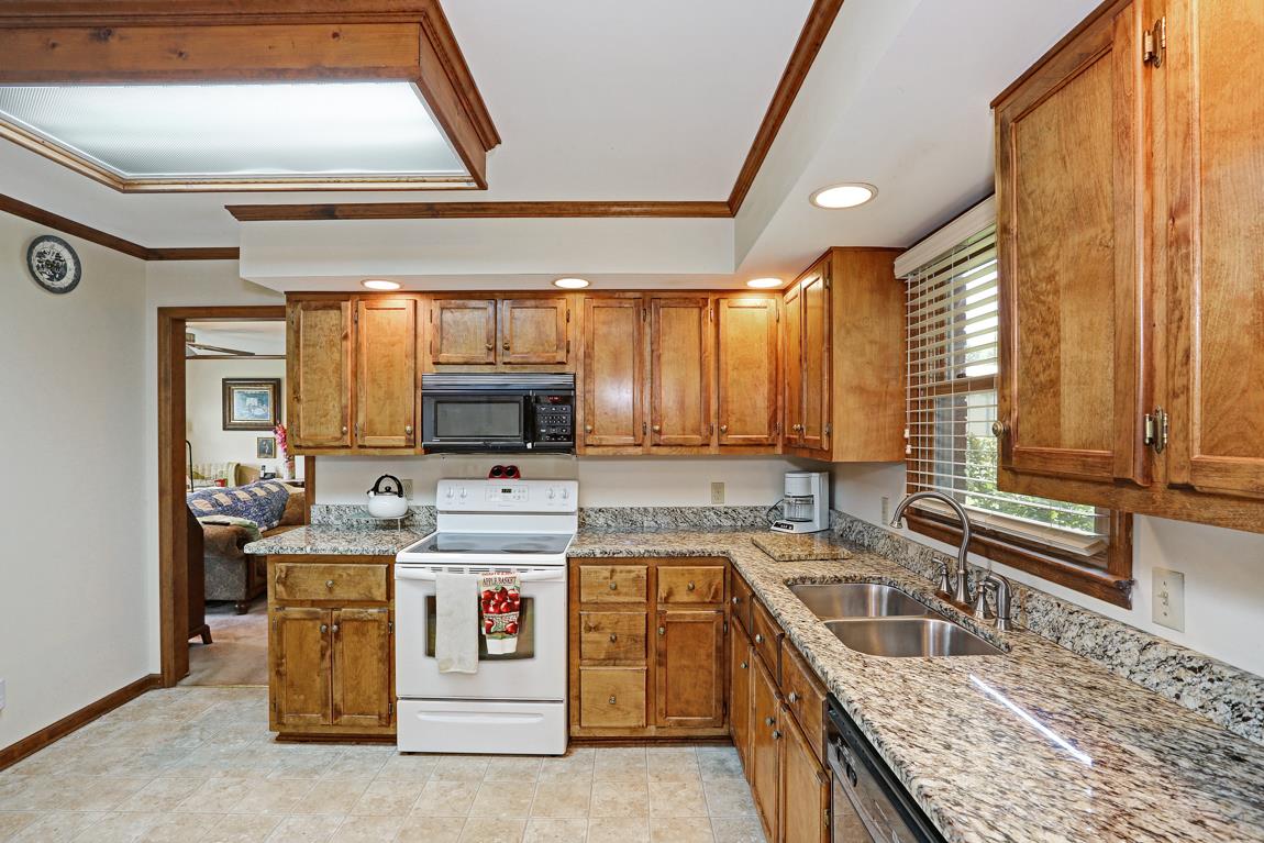 6536 Prospect Road Prospect, TN 38477 - Photo 8 of 30 a kitchen with a stove a sink and a microwave