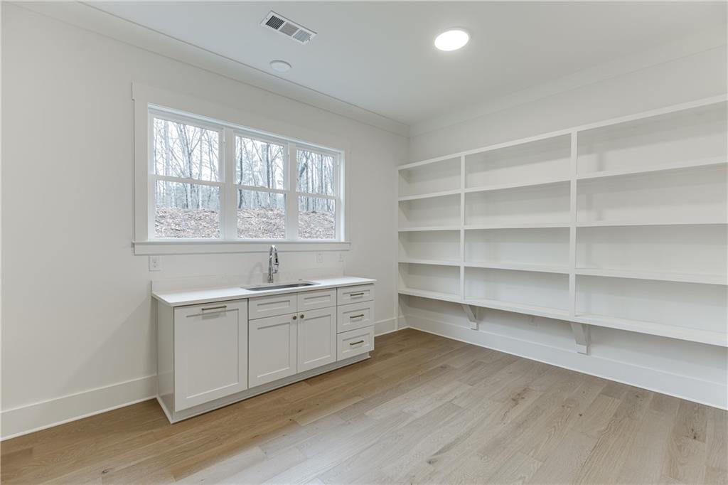 100 Gleneagles Way Pendergrass, GA 30567 - Photo 22 of 58 a room with a wooden floor and a window