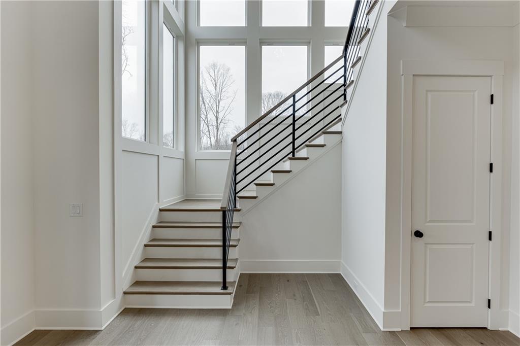 100 Gleneagles Way Pendergrass, GA 30567 - Photo 30 of 58 a view of entryway with wooden floor and stairs