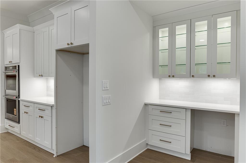 100 Gleneagles Way Pendergrass, GA 30567 - Photo 31 of 58 a view of an empty room with cabinet and mirrors