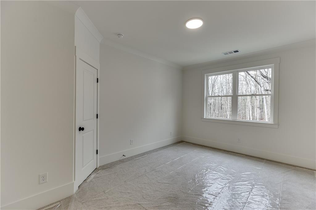 100 Gleneagles Way Pendergrass, GA 30567 - Photo 32 of 58 an empty room with windows and closet