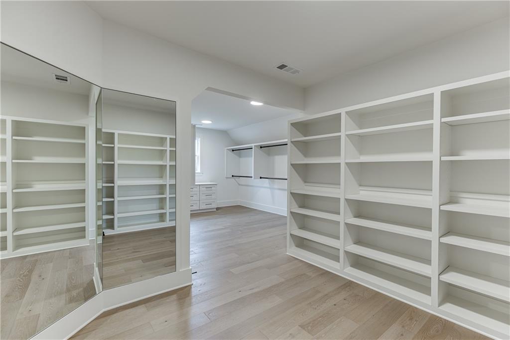 100 Gleneagles Way Pendergrass, GA 30567 - Photo 53 of 58 a view of walk in closet with empty racks