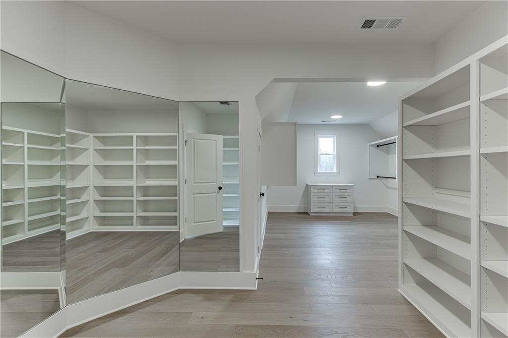 100 Gleneagles Way Pendergrass, GA 30567 - Photo 54 of 58 a view of an empty room with empty shelves