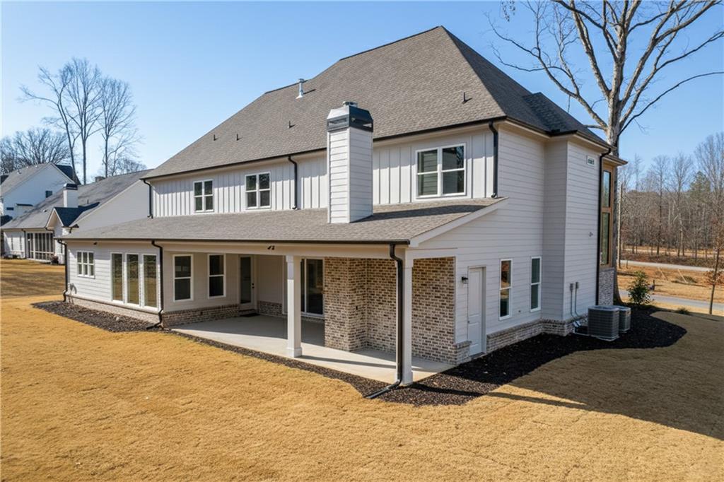 100 Gleneagles Way Pendergrass, GA 30567 - Photo 56 of 58 a front view of a house with a yard