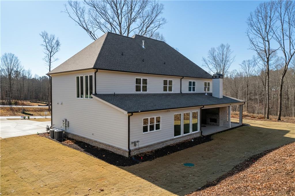 100 Gleneagles Way Pendergrass, GA 30567 - Photo 57 of 58 a front view of a house with a yard